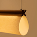 CATA Walnut lineáris függőlámpa részlete a Bazzikoshop kínálatában, Faro Barcelona, diófa csatlakozással közelről
