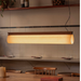 CATA Walnut lineáris függőlámpa a Bazzikoshop kínálatában, Faro Barcelona, éttermi pult fölött